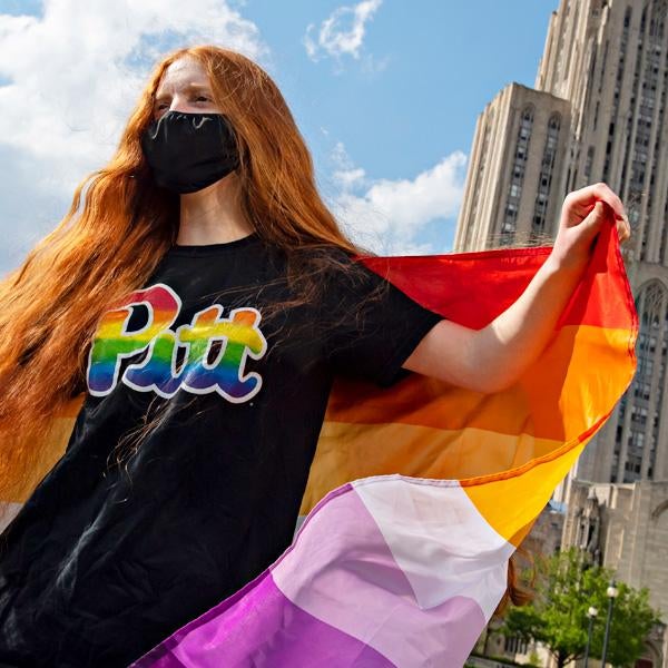 photo of a 51ƷƵ student with a Pride flag